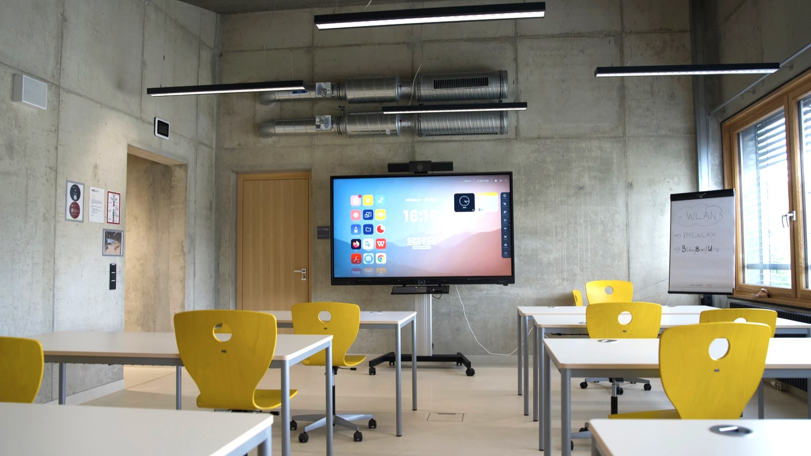 Interactive board system in a modern classroom, inspected and documented by FASTNET